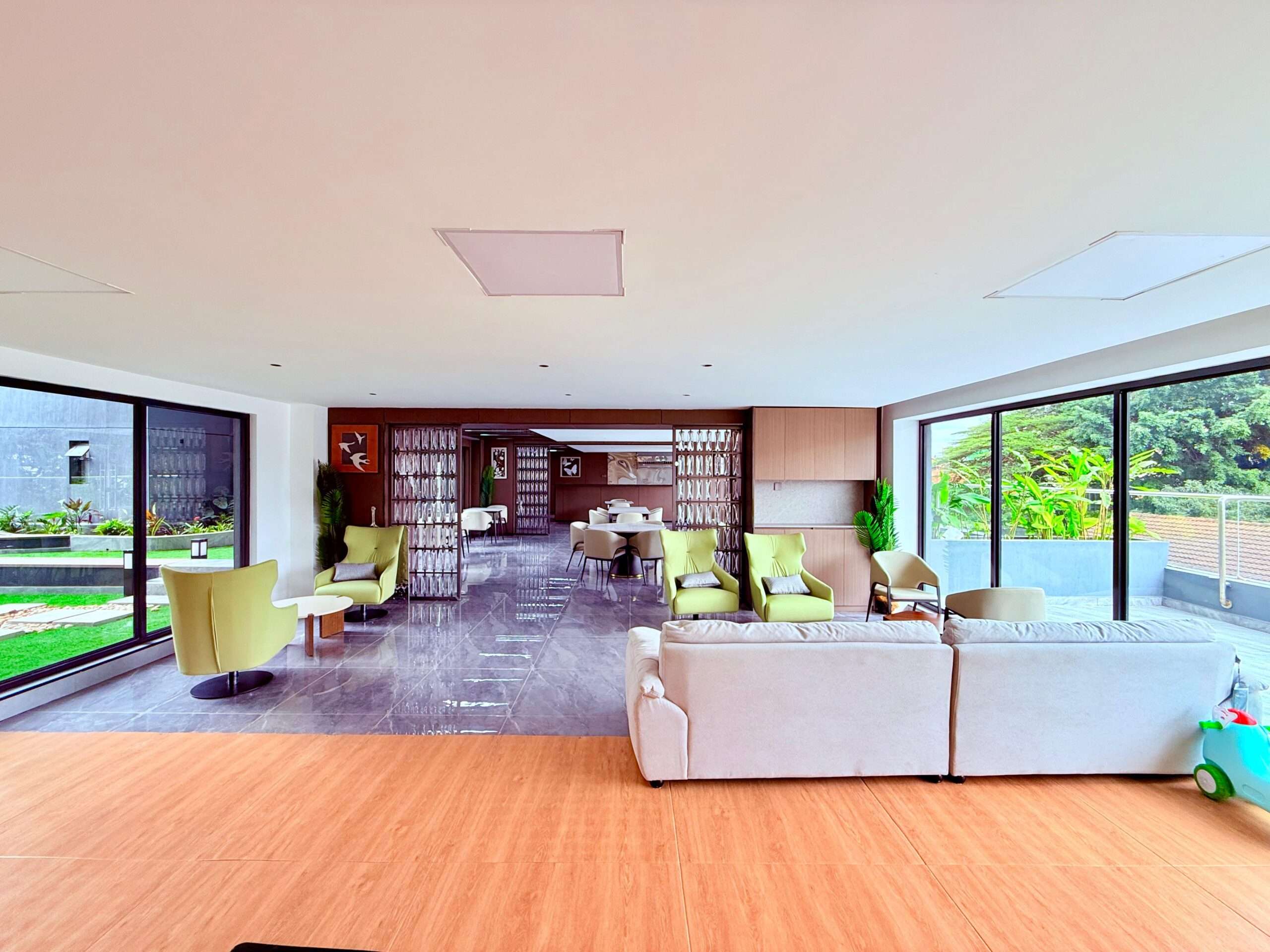 Residents’ recreation lounge with seating and terrace access at Oak Classic Residency in Kilimani