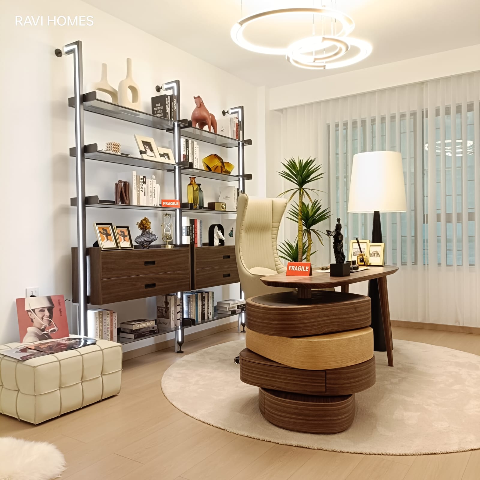 Royal Legend Residence home office featuring a modern wooden study desk, upholstered office chair, built-in bookshelves, floor lamp, and contemporary décor.