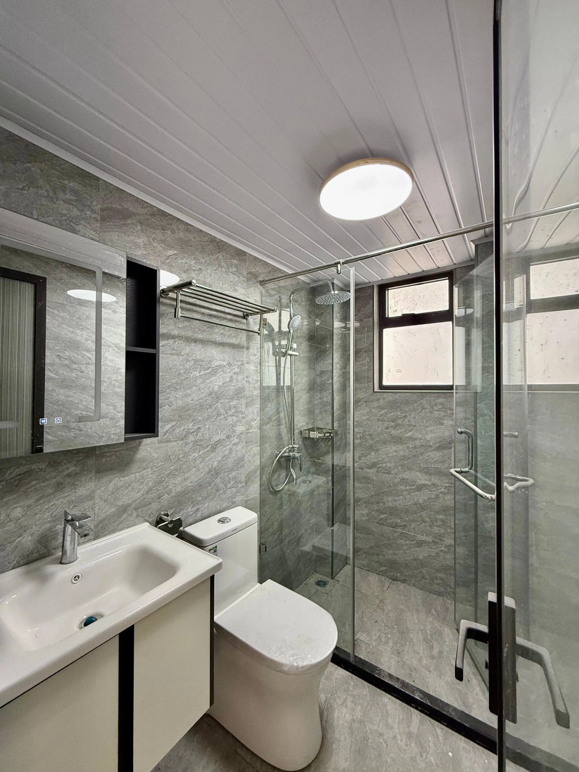 Modern bathroom with glass shower at Alina Harbour