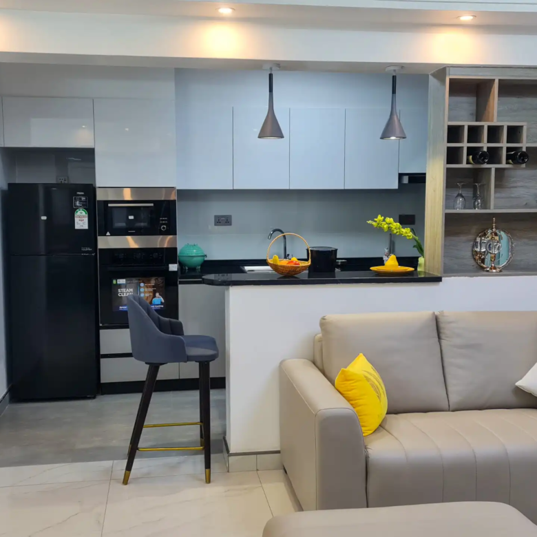 Open-plan kitchen and living room at Alina Harbour apartments