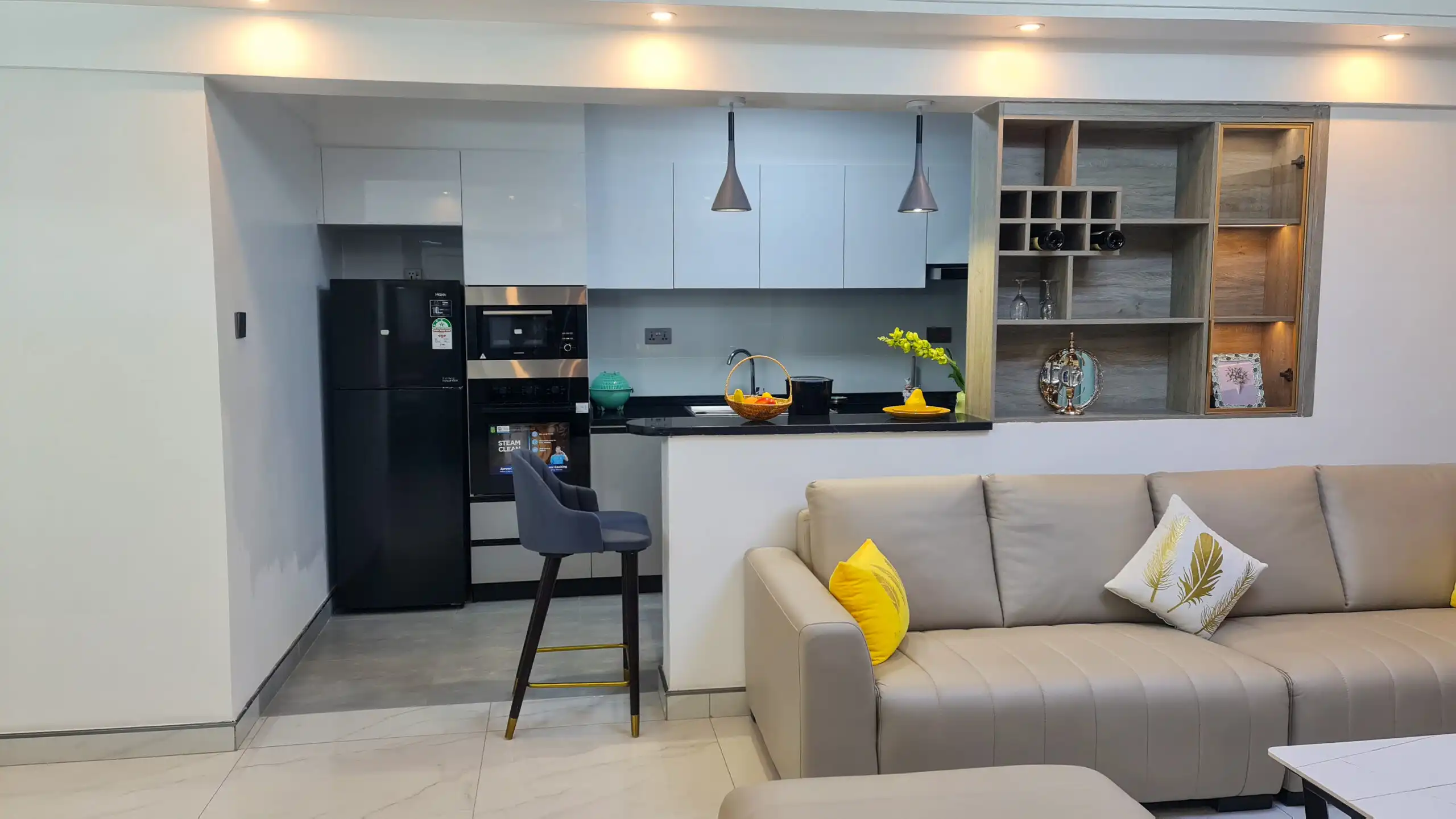 Open-plan kitchen and living room at Alina Harbour apartments