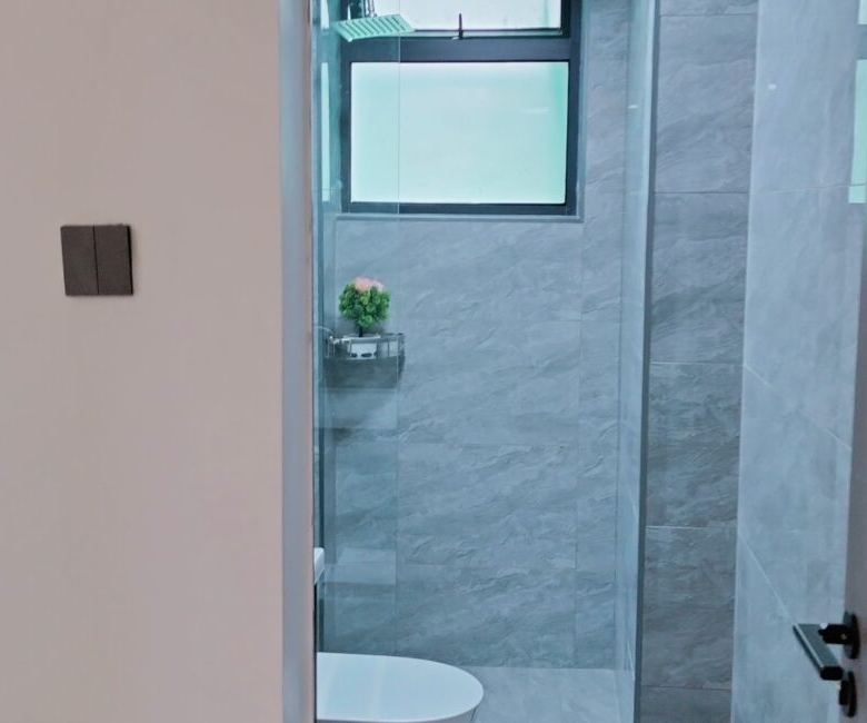 Bathroom entrance at Alina Valley Apartments Kilimani with glass shower section