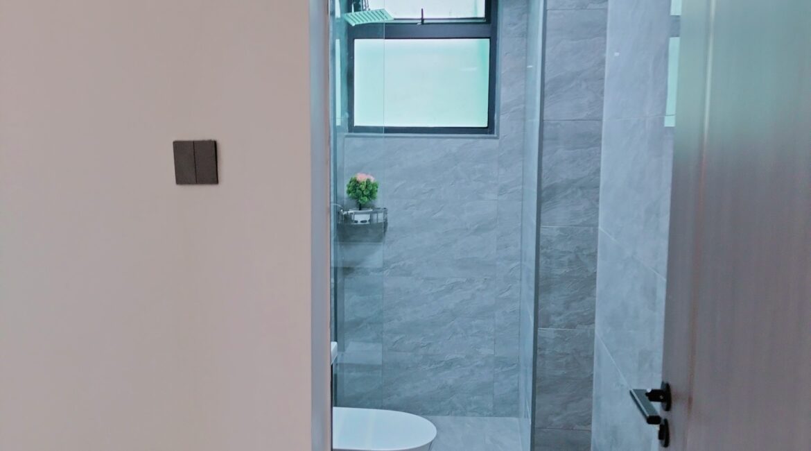 Bathroom entrance at Alina Valley Apartments Kilimani with glass shower section