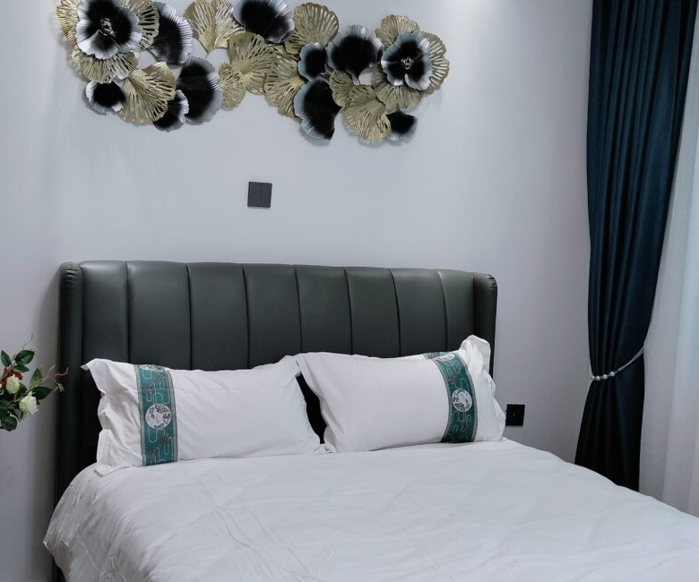Bedroom at Alina Valley Apartments Kilimani with window and natural light