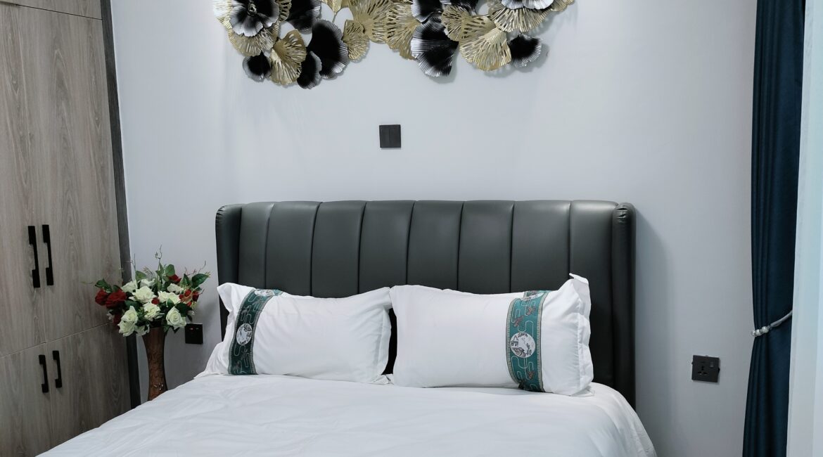 Bedroom at Alina Valley Apartments Kilimani with decorative wall art