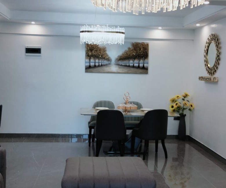 Dining area at Alina Valley Apartments Kilimani with chandelier lighting
