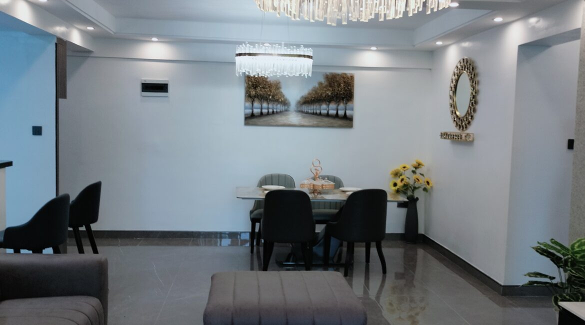 Dining area at Alina Valley Apartments Kilimani with chandelier lighting