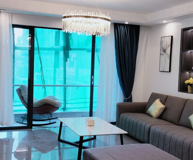 Furnished lounge at Alina Valley Apartments Kilimani with balcony access