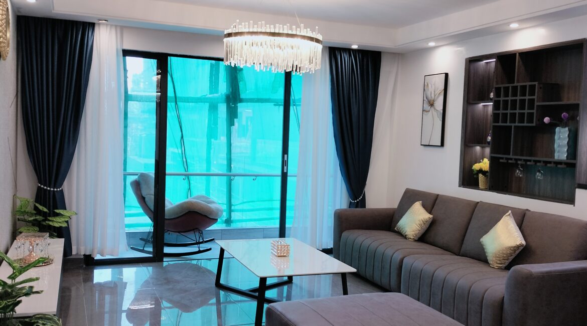 Furnished lounge at Alina Valley Apartments Kilimani with balcony access