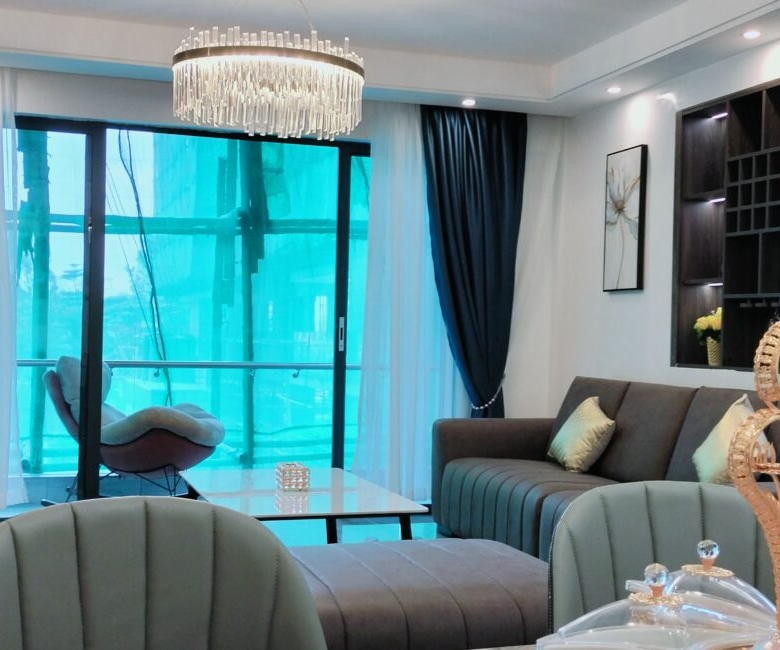 Living room at Alina Valley Apartments Kilimani with balcony access