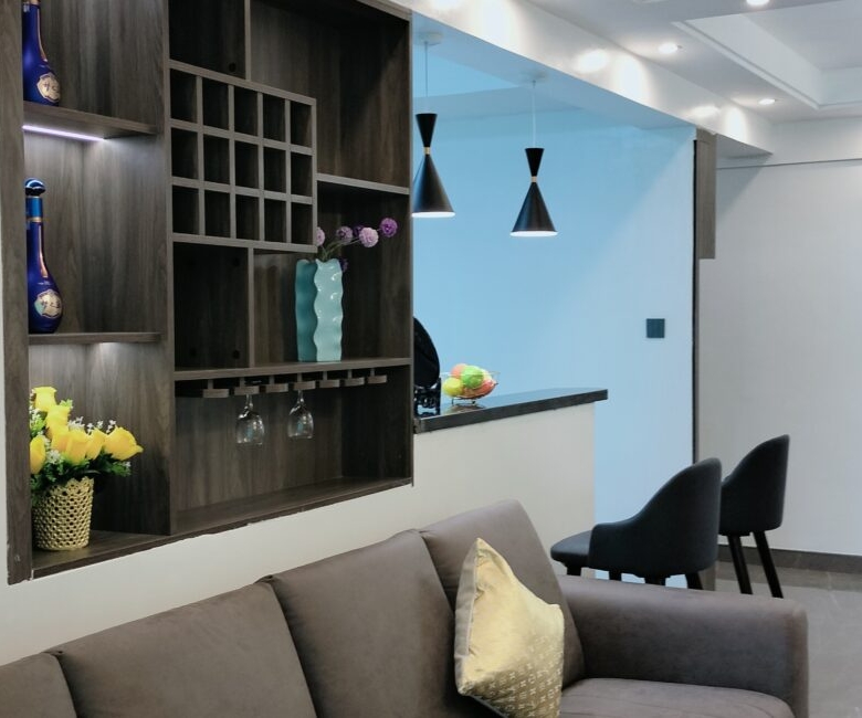 Lounge at Alina Valley Apartments Kilimani with built-in shelf and kitchen view