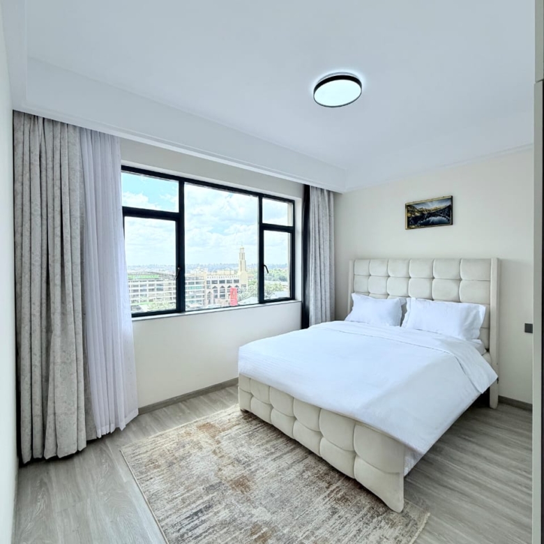 Bahari Homes Residency furnished bedroom with large window views