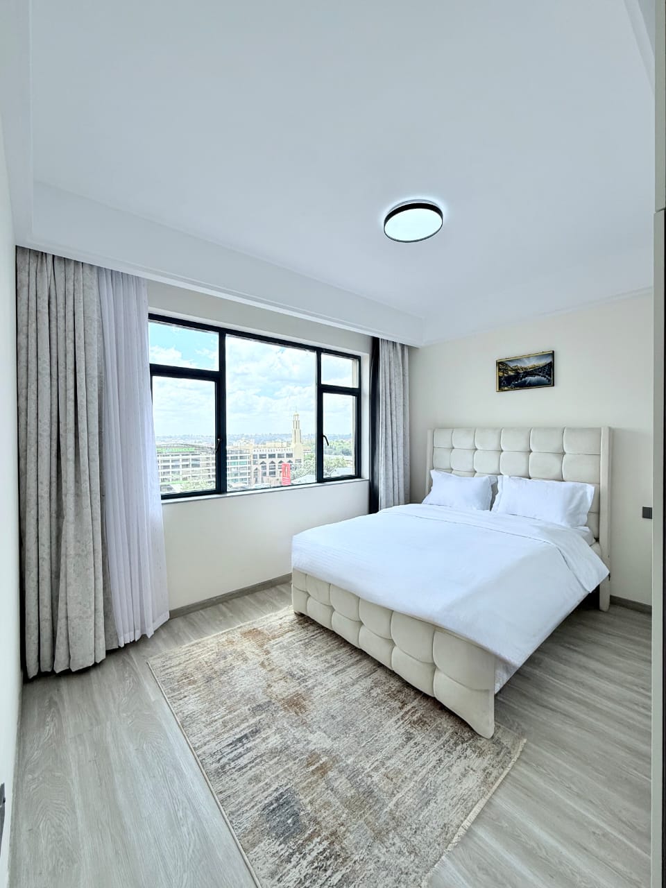 Bahari Homes Residency furnished bedroom with large window views