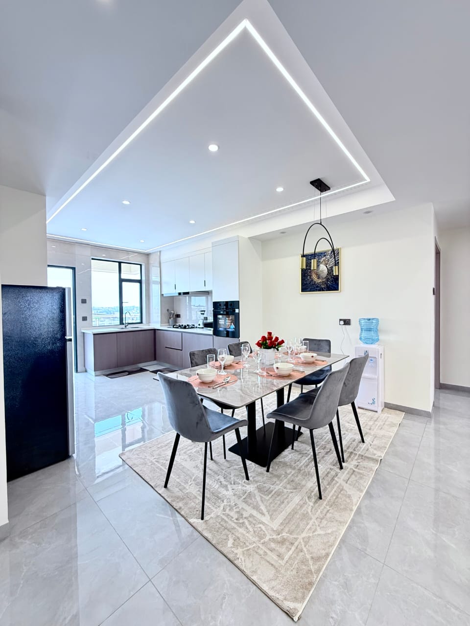 Bahari Homes Residency dining area with open kitchen in Kilimani