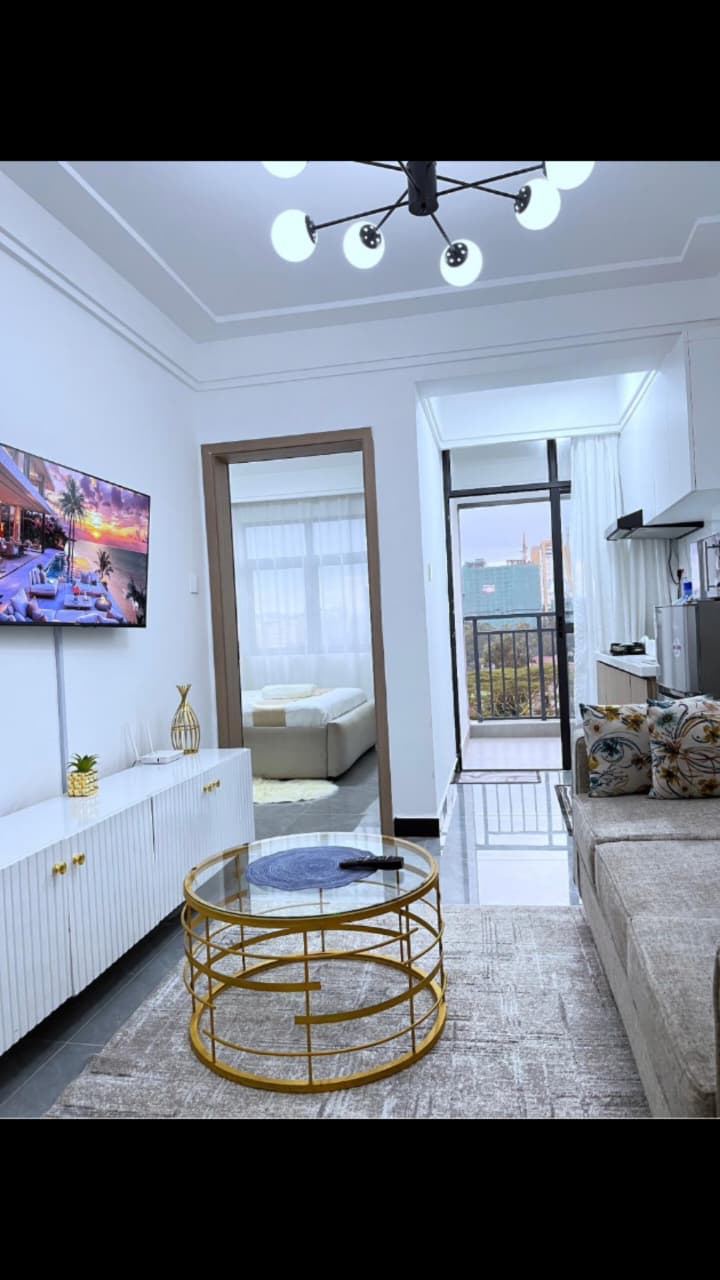 Bahari Homes Residency furnished living area with TV and kitchenette