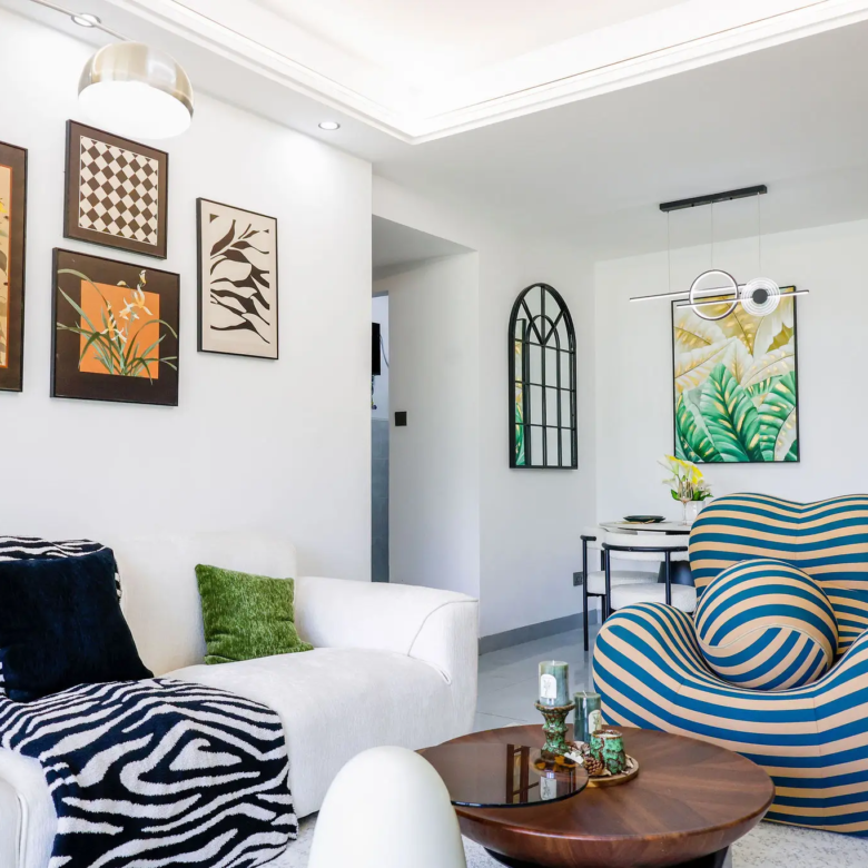 Stylish living room with large windows at Capital Garden Apartments