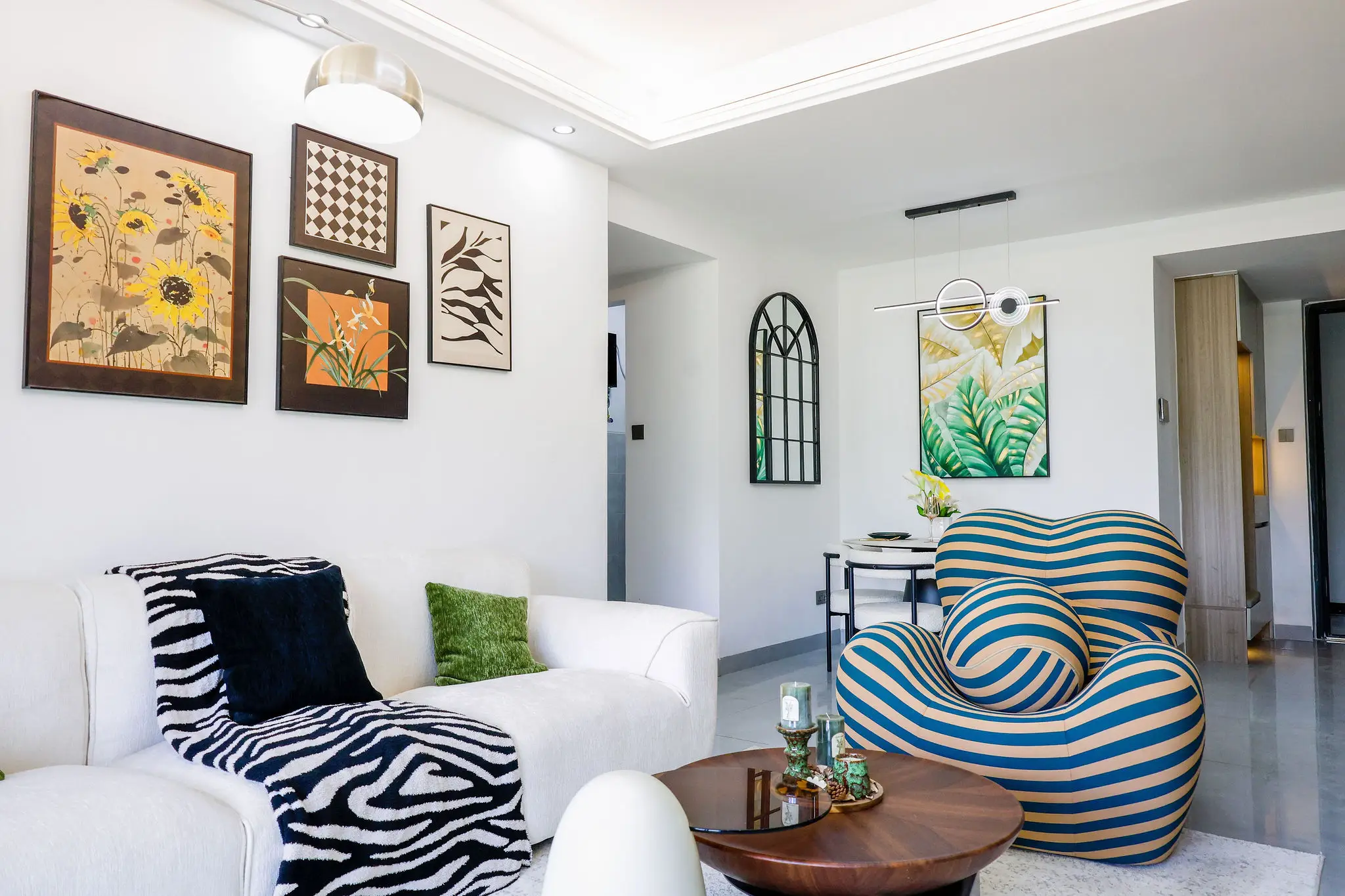 Stylish living room with large windows at Capital Garden Apartments