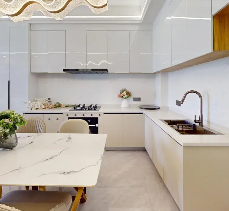 Fitted kitchen and dining area at Plumeria Residency Apartments