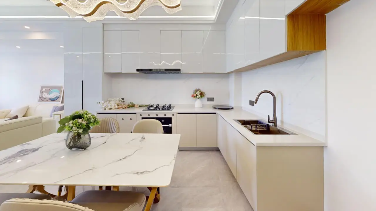 Fitted kitchen and dining area at Plumeria Residency Apartments