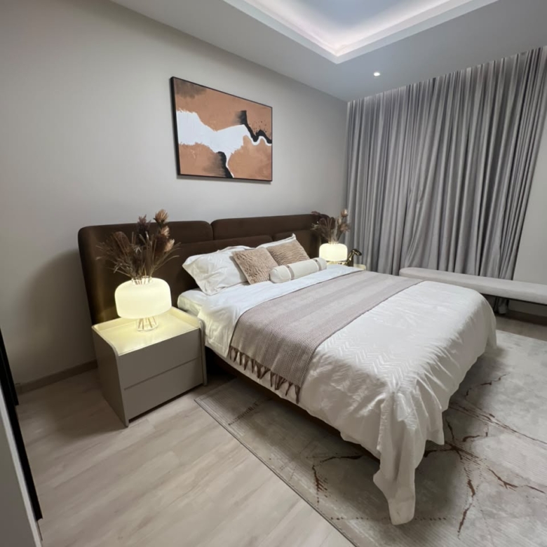 Furnished bedroom at Verona Apartments Westlands with bedside lighting and window seating