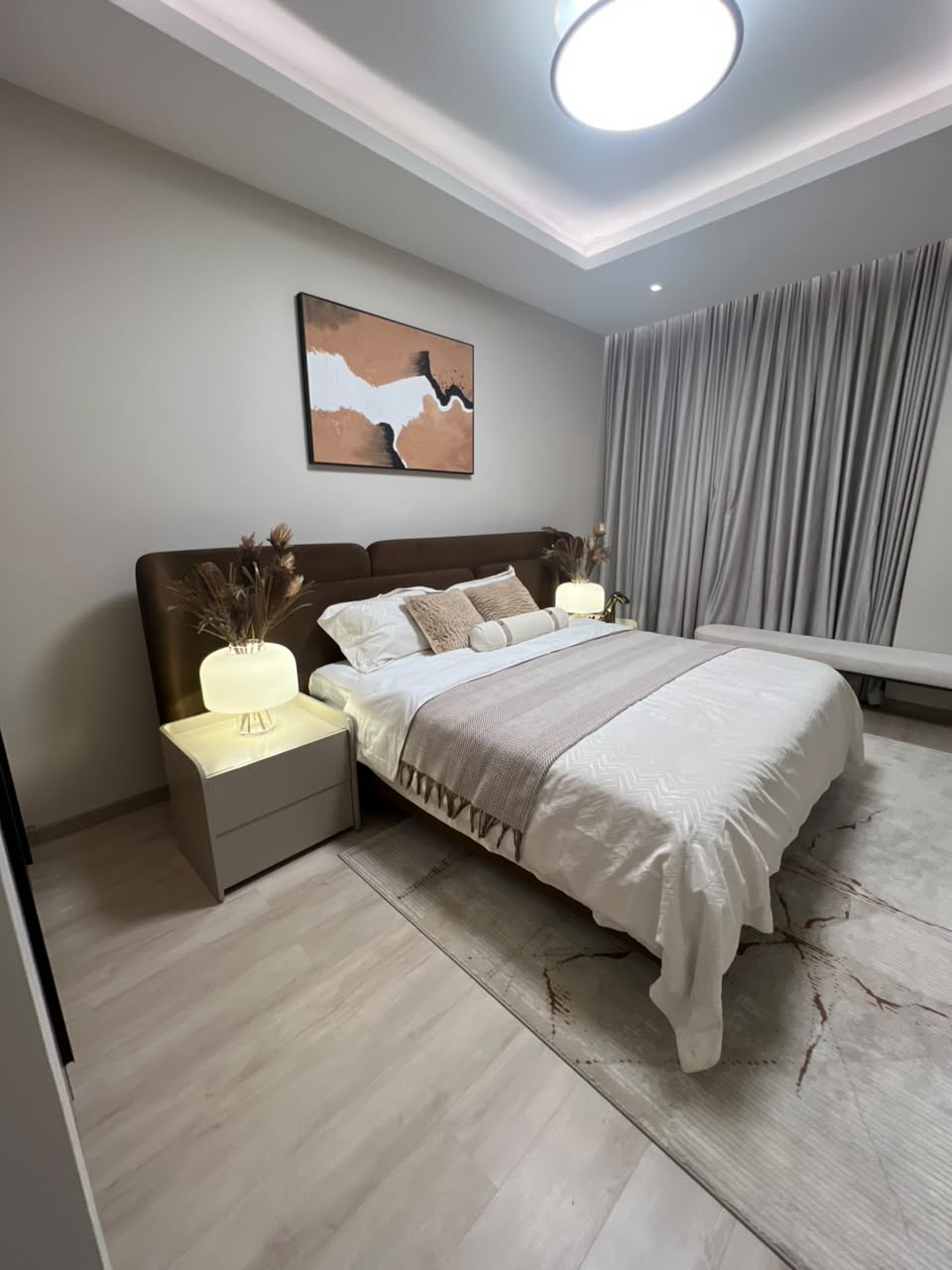 Furnished bedroom at Verona Apartments Westlands with bedside lighting and window seating