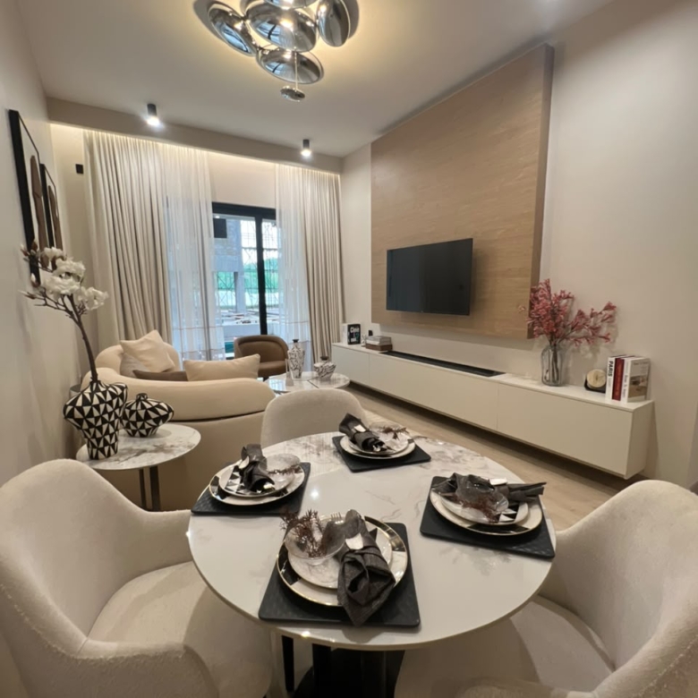 Furnished living and dining room at Verona Apartments Westlands with a modern television wall