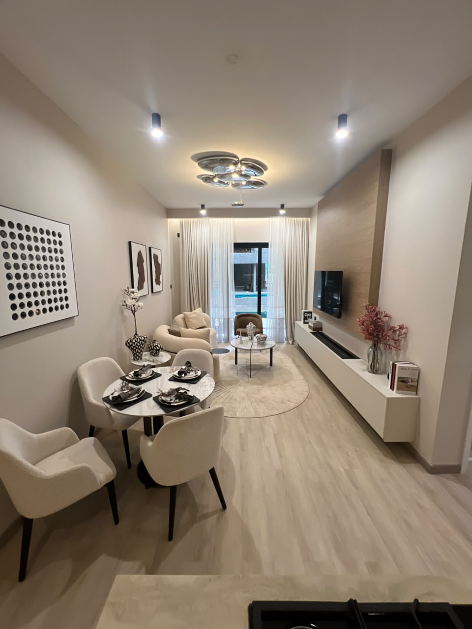 Open-plan lounge and dining area at Verona Apartments Westlands with modern furniture
