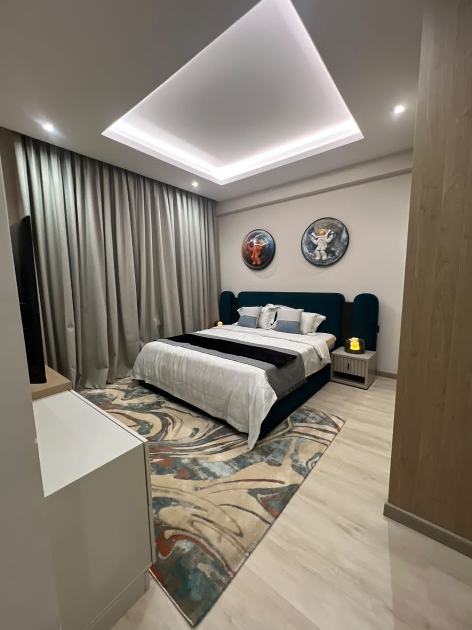 Spacious show apartment bedroom at Verona Apartments Westlands with modern ceiling lighting