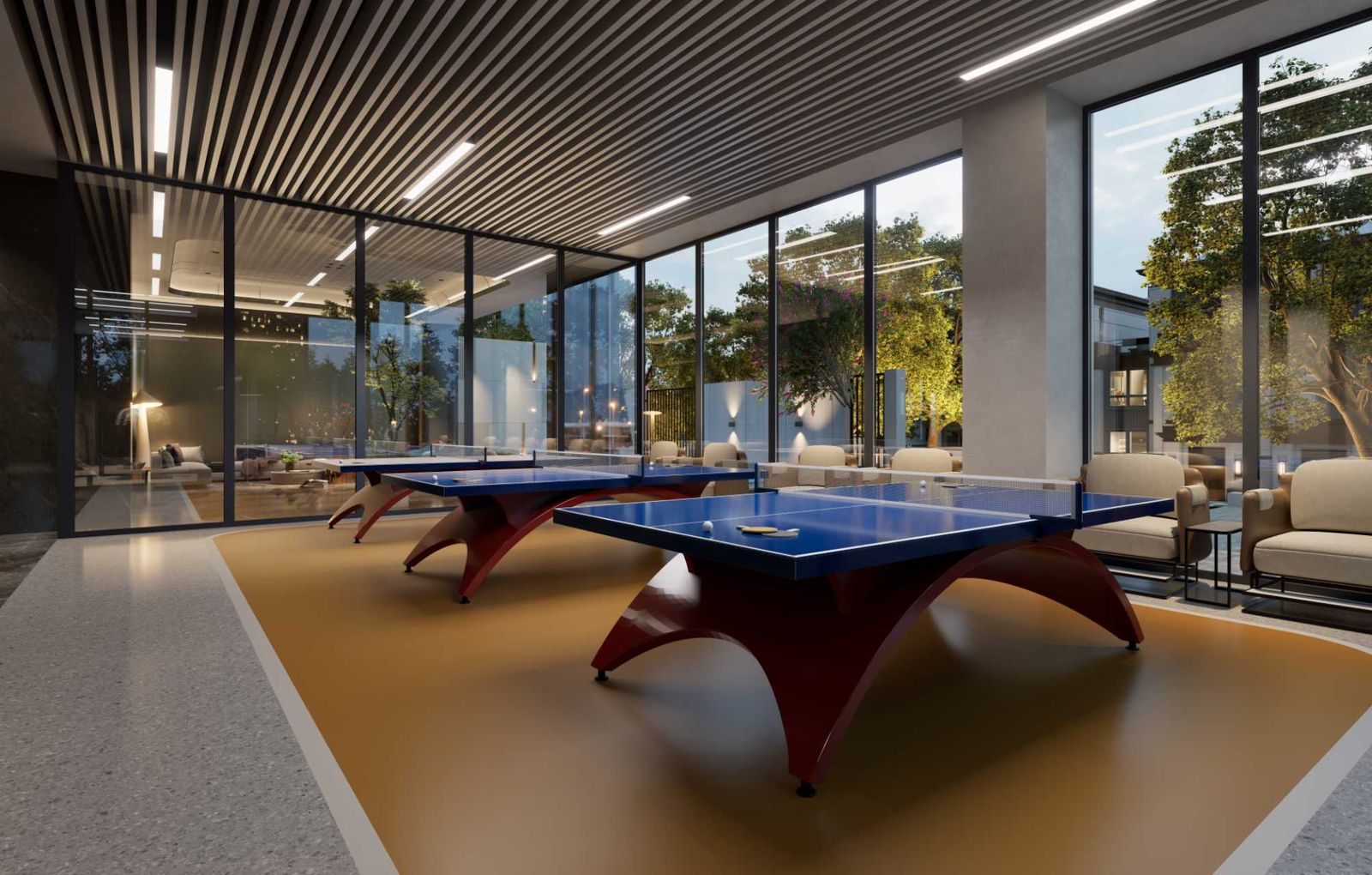 Oxford Homes Residency indoor games room featuring two table tennis tables, lounge seating, floor-to-ceiling windows, and modern ceiling lighting.