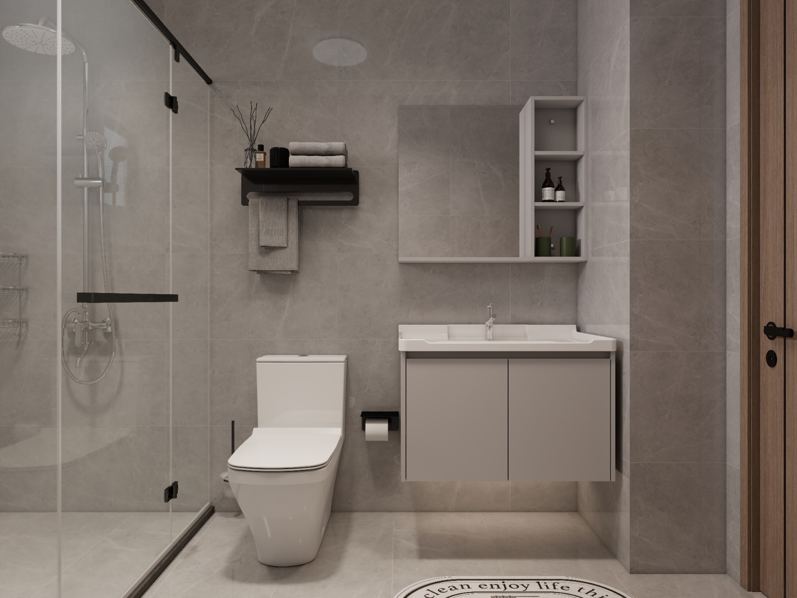 Oxford Homes Residency bathroom featuring a glass-enclosed rainfall shower, wall-mounted vanity, modern toilet, and grey marble-look tiles.