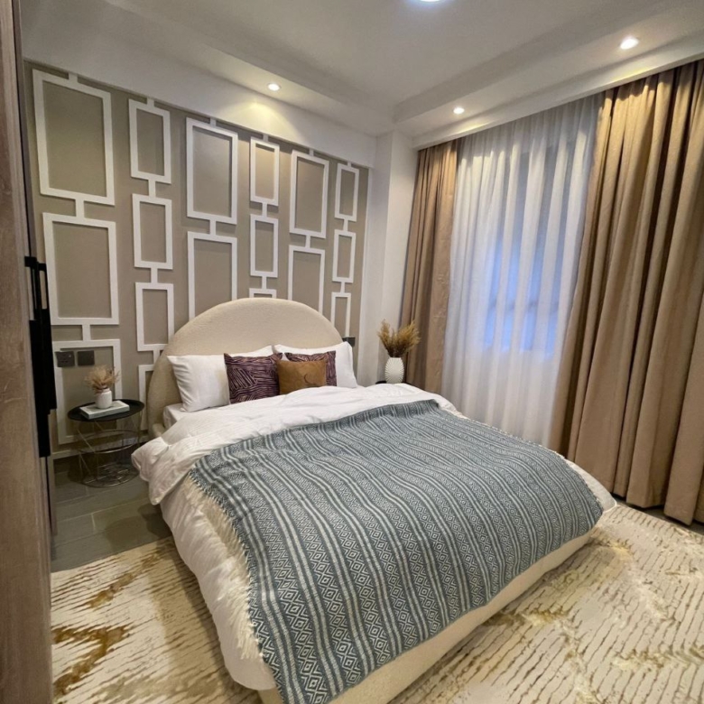 Modern furnished bedroom at Padmore Residency on George Padmore Road