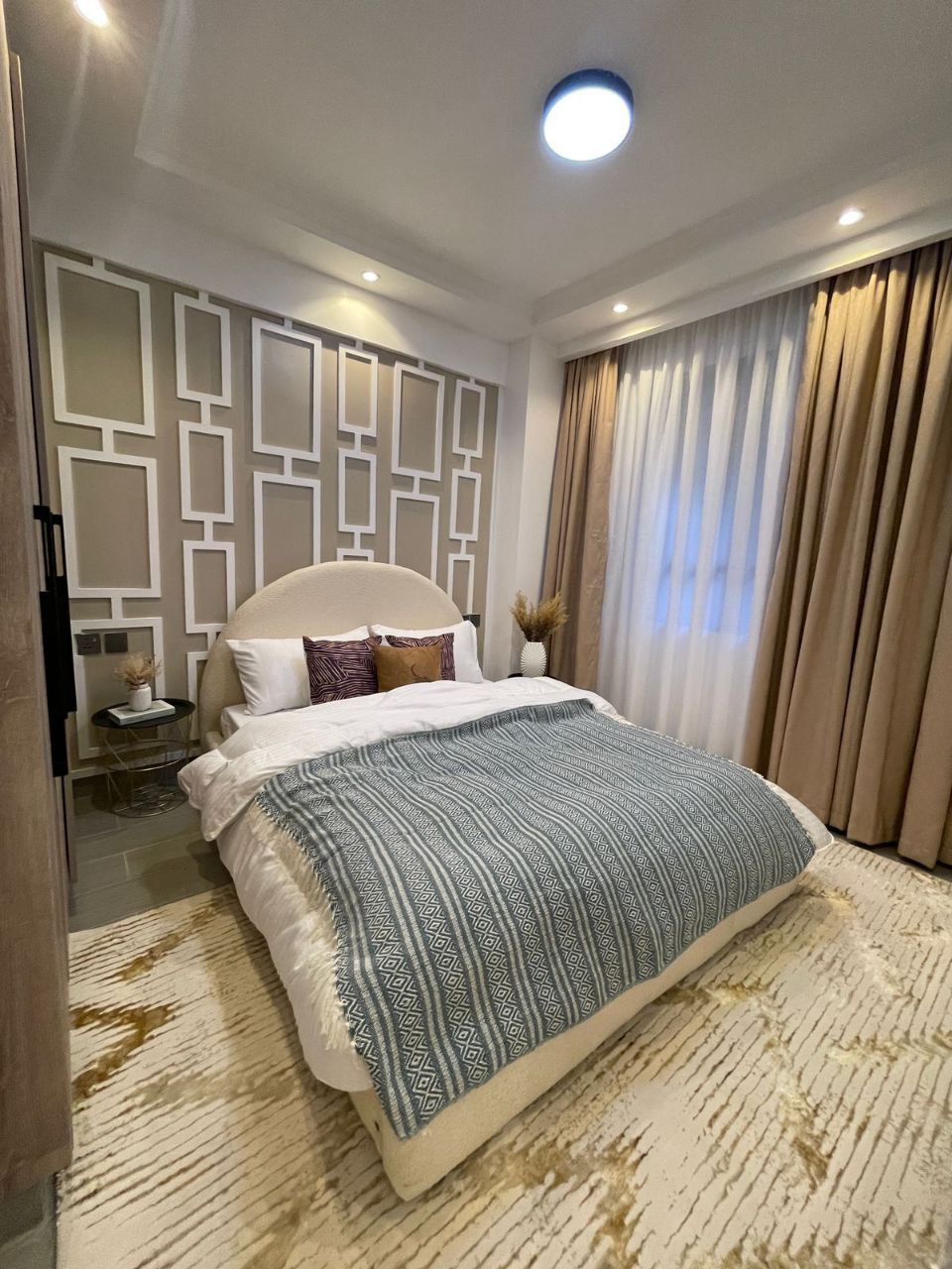 Modern furnished bedroom at Padmore Residency on George Padmore Road