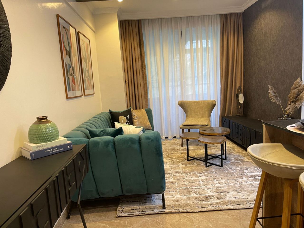 Contemporary lounge with green sofa at Padmore Residency
