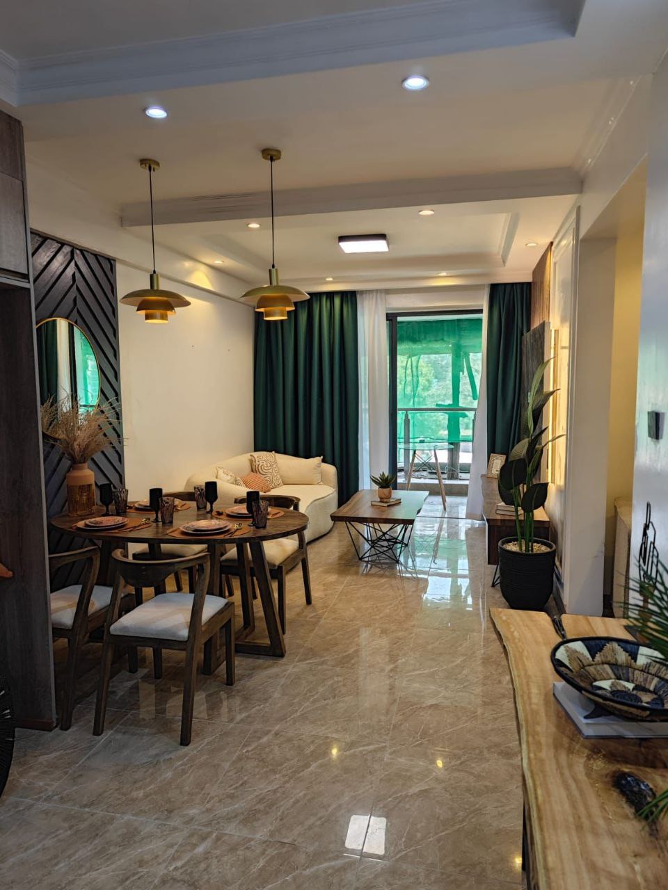 Furnished open-plan living and dining area at Padmore Residency Kilimani