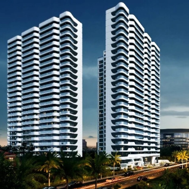 Amani Residence twin-tower exterior rendering featuring modern high-rise apartments, curved white balconies, large windows, and landscaped surroundings.