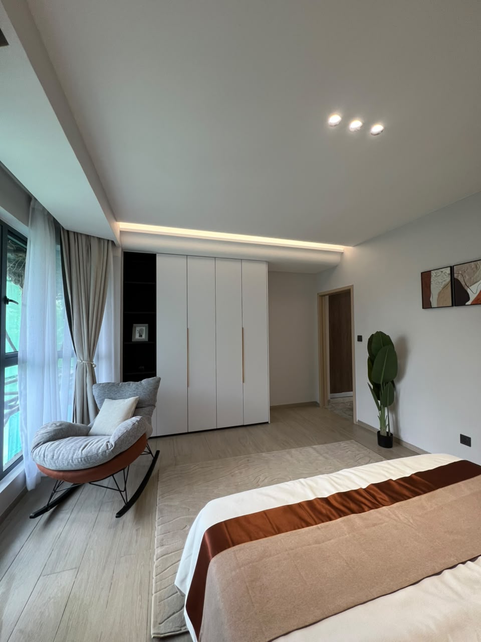 Bedroom wardrobe and sitting area at Golfscape Residences Kilimani apartments