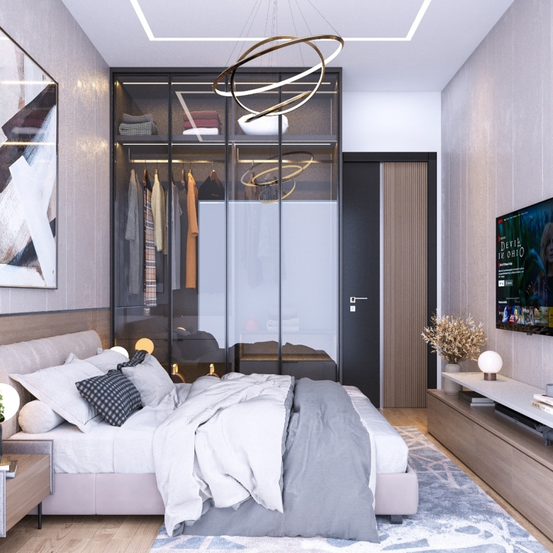 Fountain Residency luxury bedroom with a double bed, glass-front fitted wardrobes, modern ring chandelier, wall-mounted television, and wooden bedside tables.