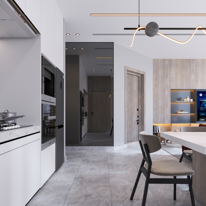 Fountain Residency open-plan apartment interior featuring a modern fitted kitchen, white dining table, integrated appliances, contemporary lighting, and an adjoining living room.