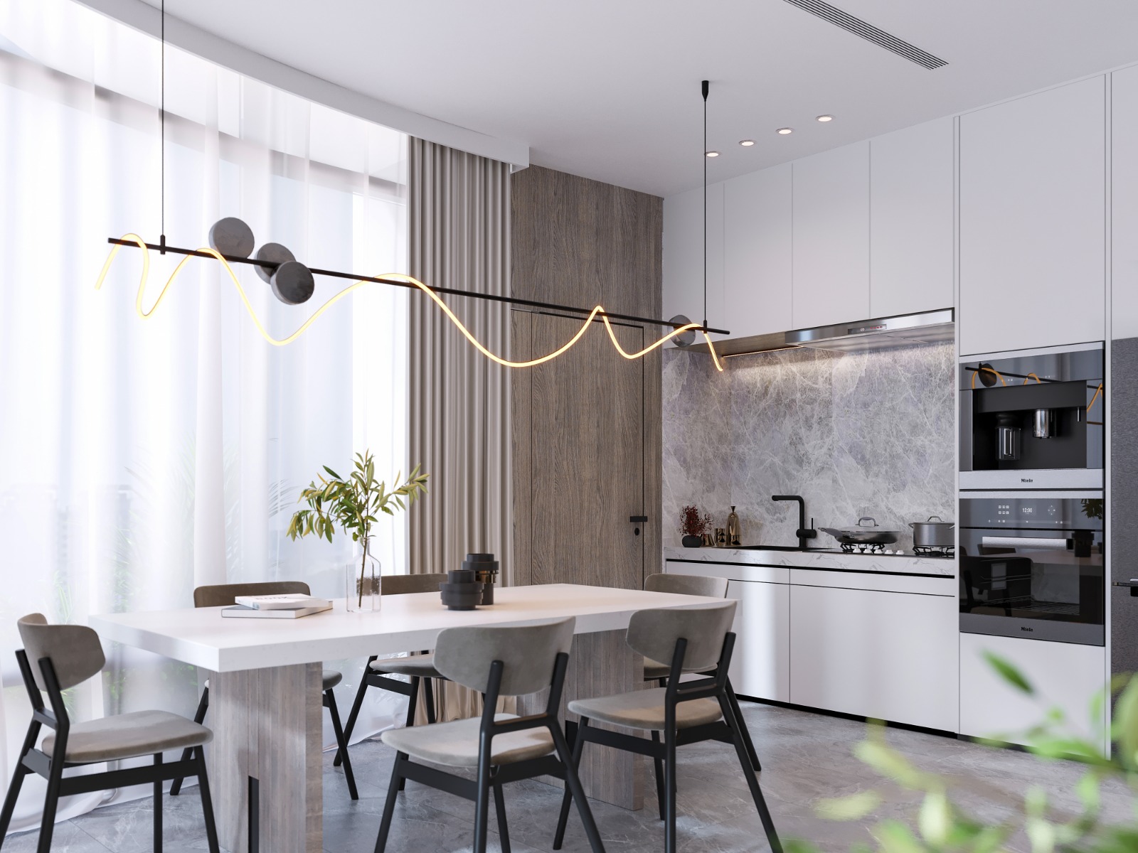 Fountain Residency dining area featuring a modern white dining table, upholstered chairs, designer pendant lighting, and a fitted kitchen with integrated appliances.