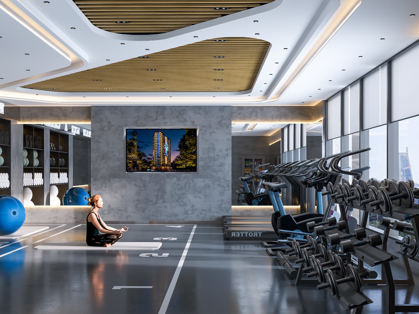 Fountain Residency fitness centre featuring gym storage shelves, exercise balls, yoga mats, kettlebells, modern lighting, and an open training area.