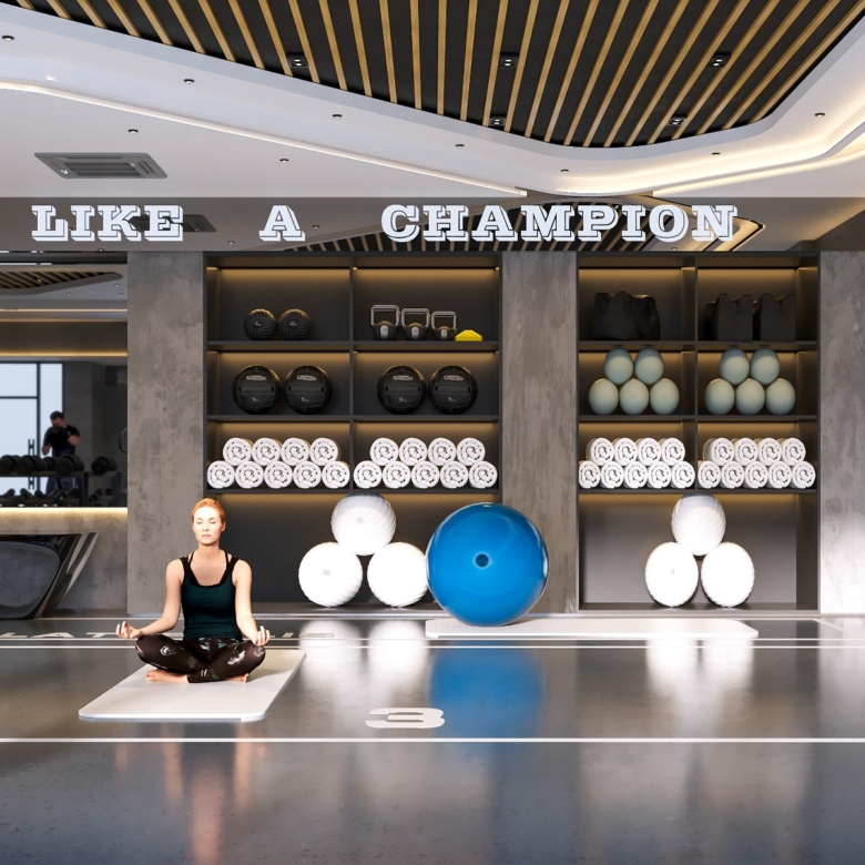Fountain Residency yoga and wellness studio featuring an open exercise floor, yoga mats, fitness balls, equipment storage shelves, and contemporary ceiling lighting.