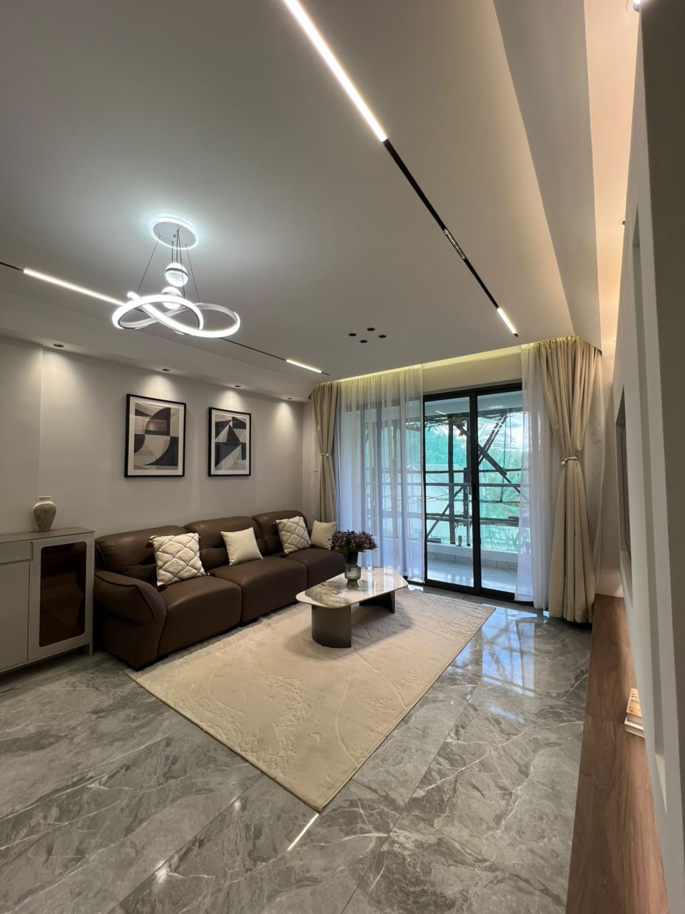 Lounge with balcony access at Golfscape Residences apartments in Kilimani