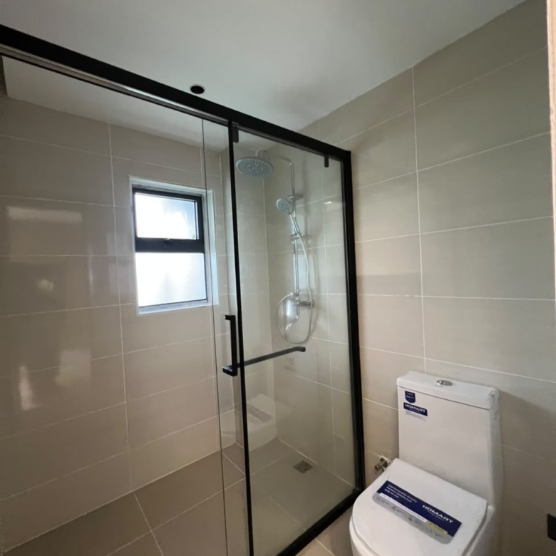 Bathroom with glass shower at Golfscape Residences apartments in Kilimani