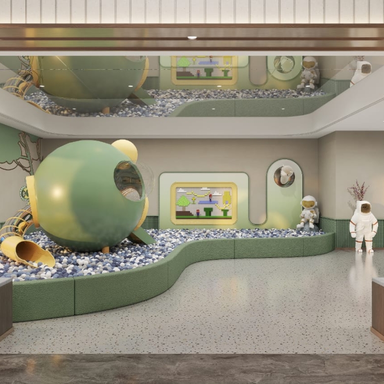 Golden Mansion Apartments indoor children's play area featuring a colourful ball pit, tube slides, interactive play structures, and a space-themed design.