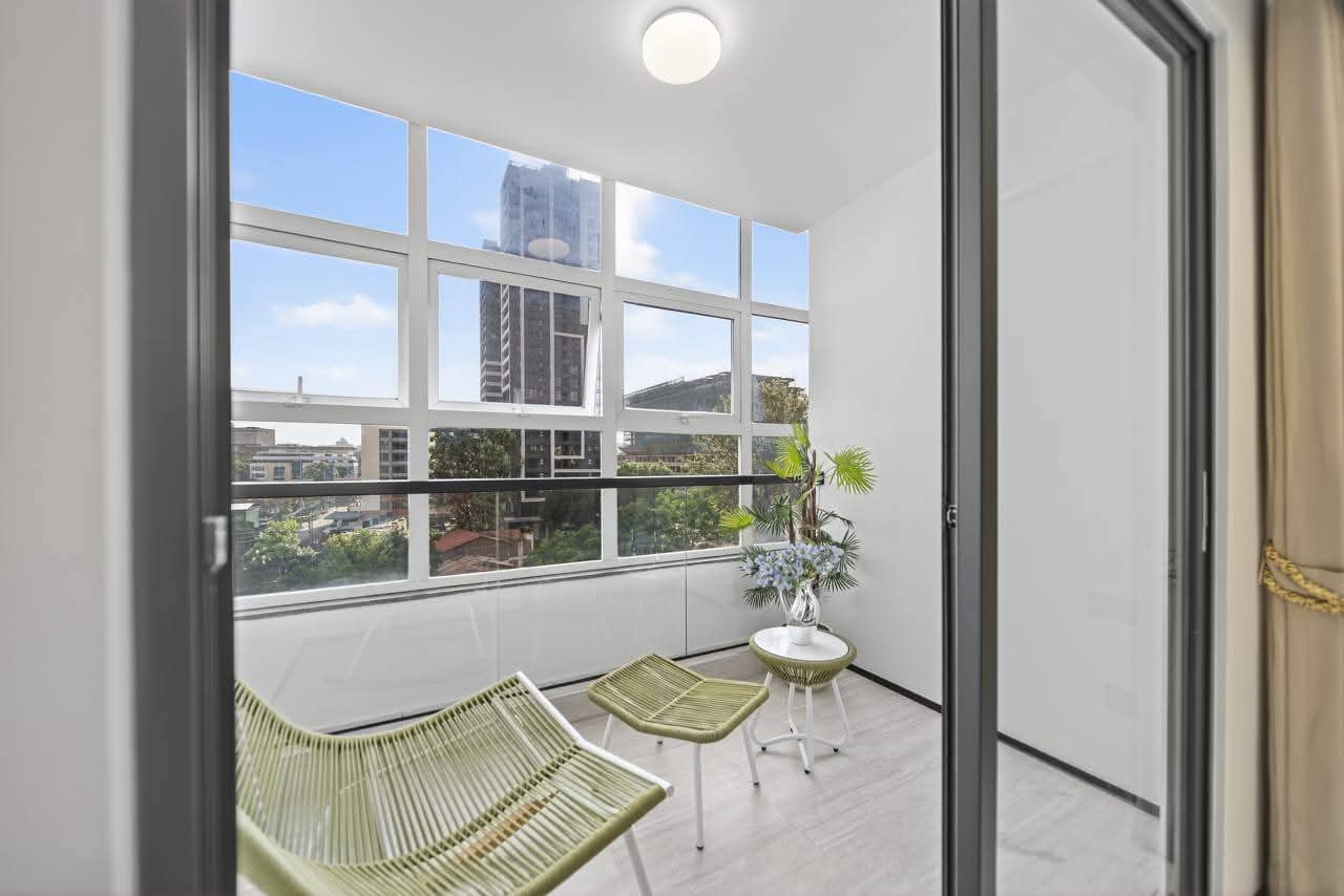 Enclosed balcony with urban views at Golden Mansion apartments in Westlands Nairobi