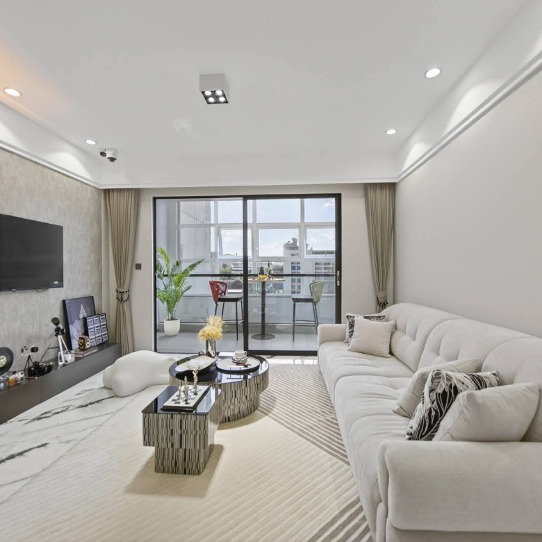 Living area with balcony access at Golden Mansion apartments for sale in Westlands
