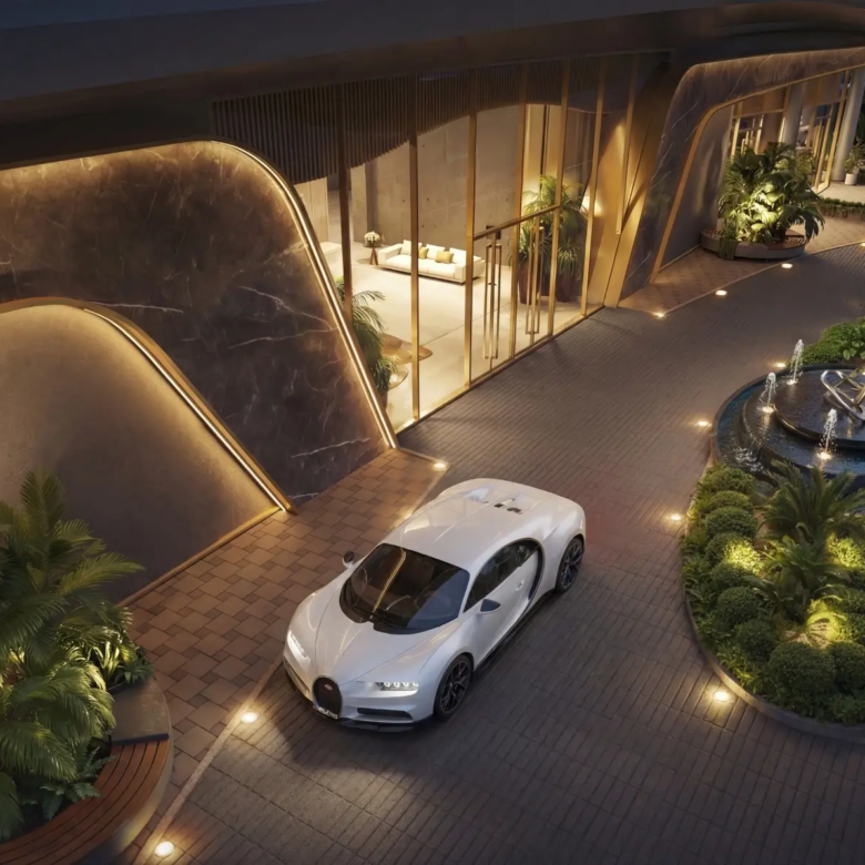 Main entrance and landscaped vehicle drop-off at Cheval Riverside Apartments
