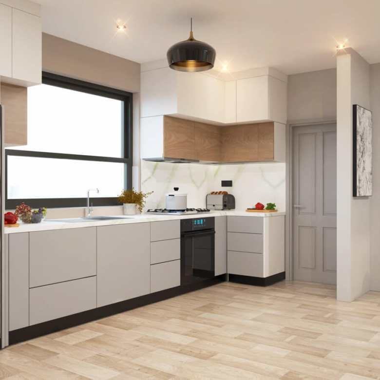 Black Olive Residency spacious modern kitchen featuring fitted cabinets, stainless steel refrigerator, integrated oven and large windows.