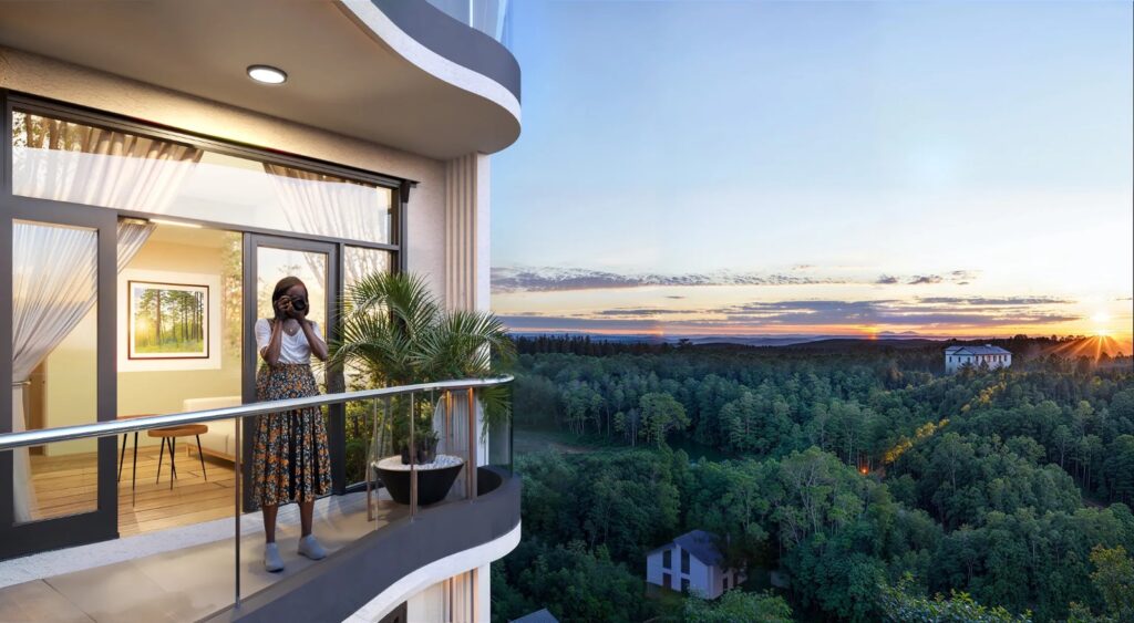 Oak Breeze Residency apartment balcony overlooking greenery at sunset