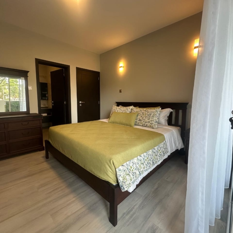 Spacious balcony overlooking greenery at Pearl Rivers Riverside